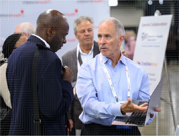 Healthier Together Conference sponsor engaging with an attendee - sponsor the May 4-6 conference in Anaheim, California