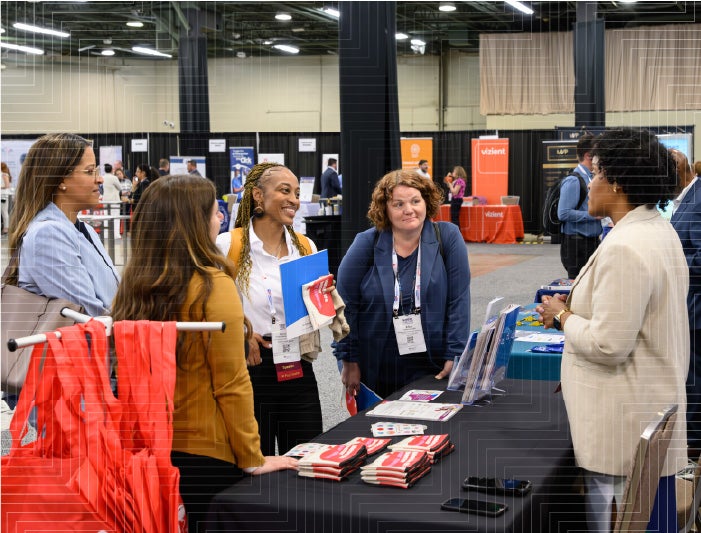 Sponsor at Healthier Together Conference speaking with attendees - sponsor the 2027 conference, taking place May 4-6 in Anaheim, California